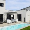 MAISON CONTEMPORAINE DESIGN A LA BAULE PATIO EXTERIEUR ET ESPACE DE VIE SPACIEUX ET LUMINEUX AVEC ESCALIER A LIMON CENTRAL