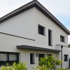 MAISON CONTEMPORAINE DESIGN A LA BAULE PATIO EXTERIEUR ET ESPACE DE VIE SPACIEUX ET LUMINEUX AVEC ESCALIER A LIMON CENTRAL