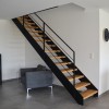 MAISON CONTEMPORAINE à LA BAULE AVEC PAREMENT PIERRE ET ENDUIT BI-COLOR, VERRIERE INTERIEURE ET ESCALIER METAL ET BOIS